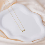 taudrey love is gold necklace