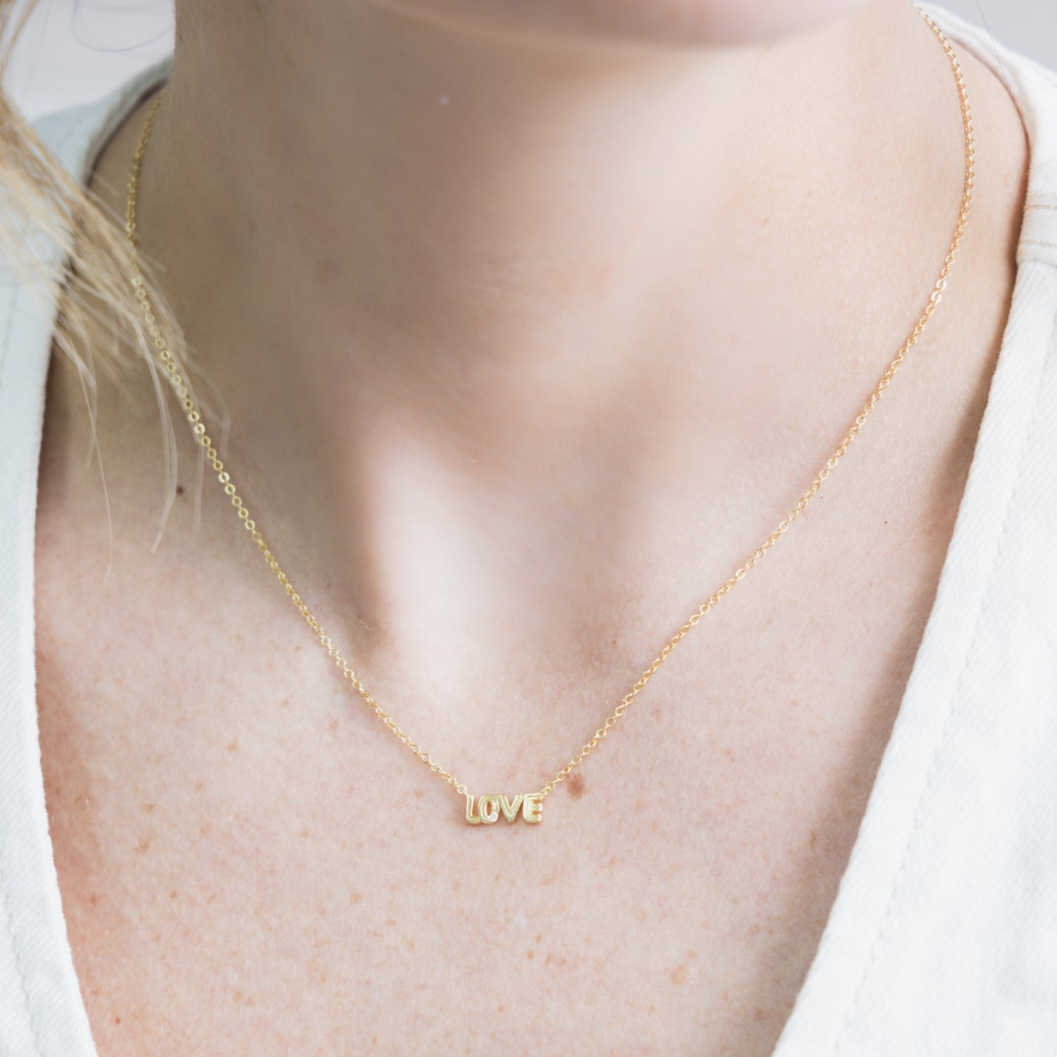 taudrey love is gold necklace