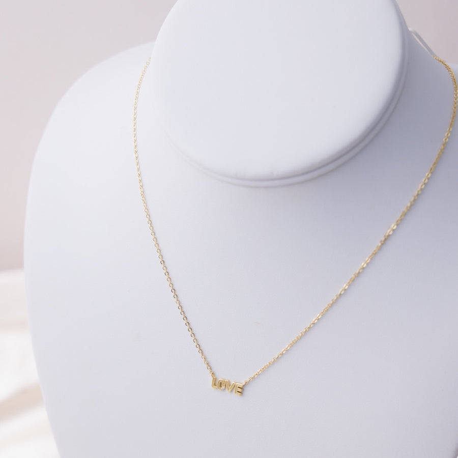 taudrey love is gold necklace